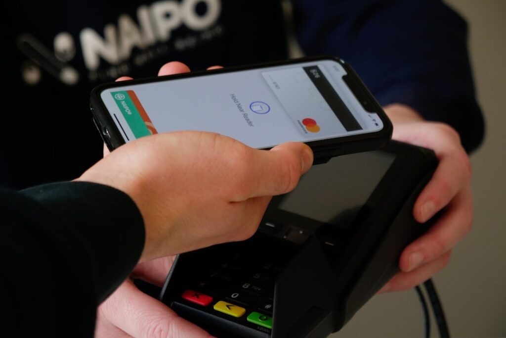 Person using a payments app on a smartphone